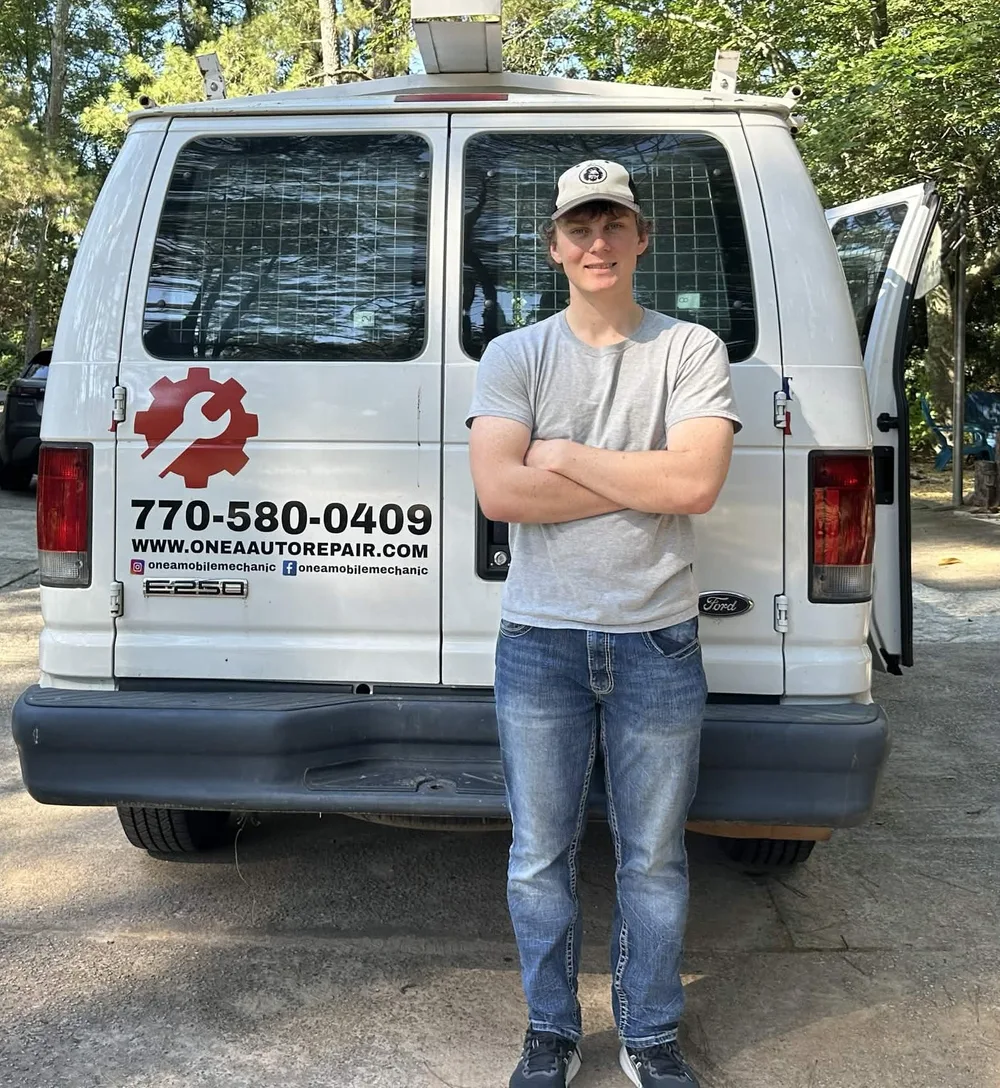 OneA mechanic beside the mobile service van