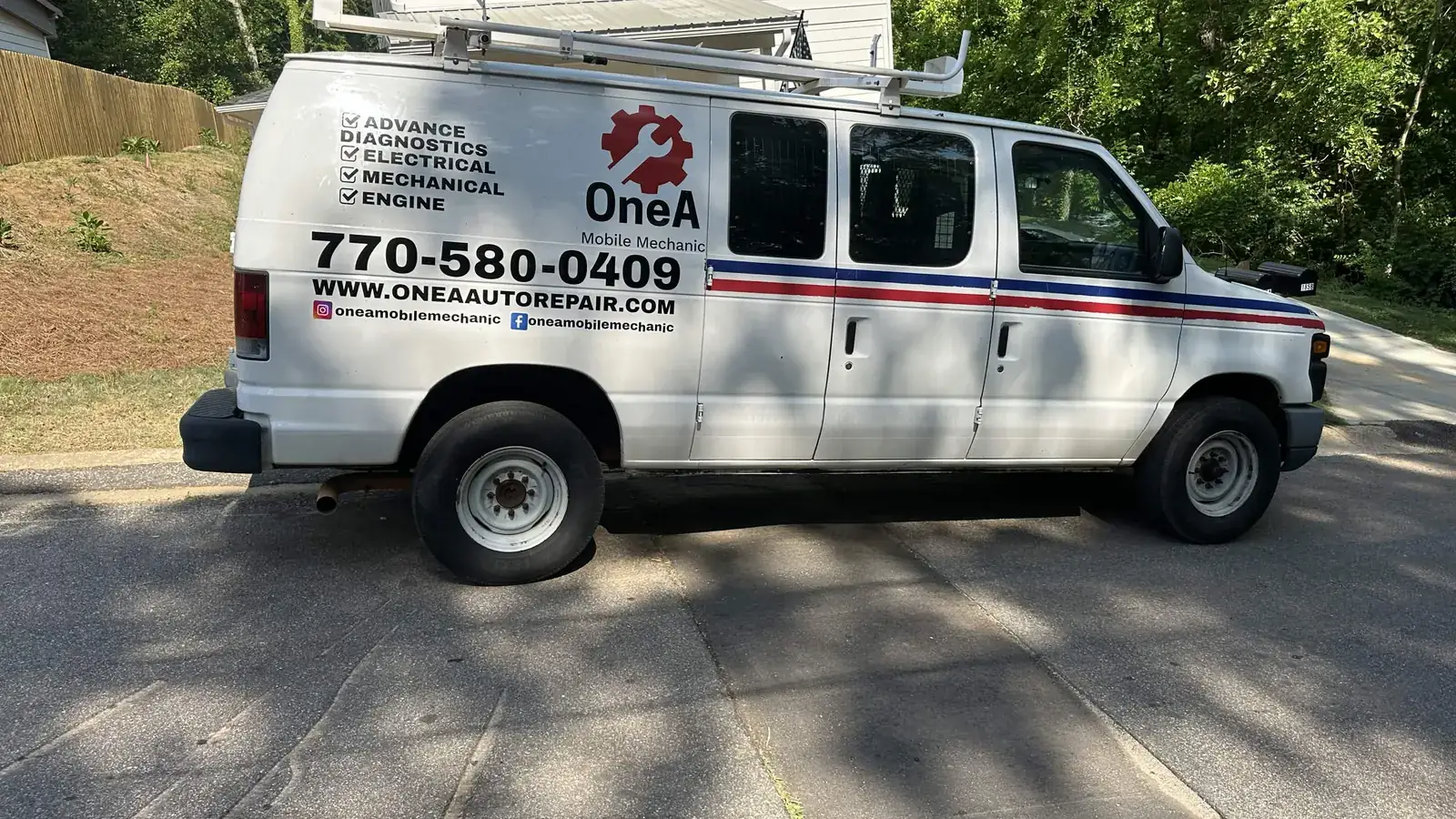 The OneA mobile auto repair van parked at a customer address in the Athens, GA area